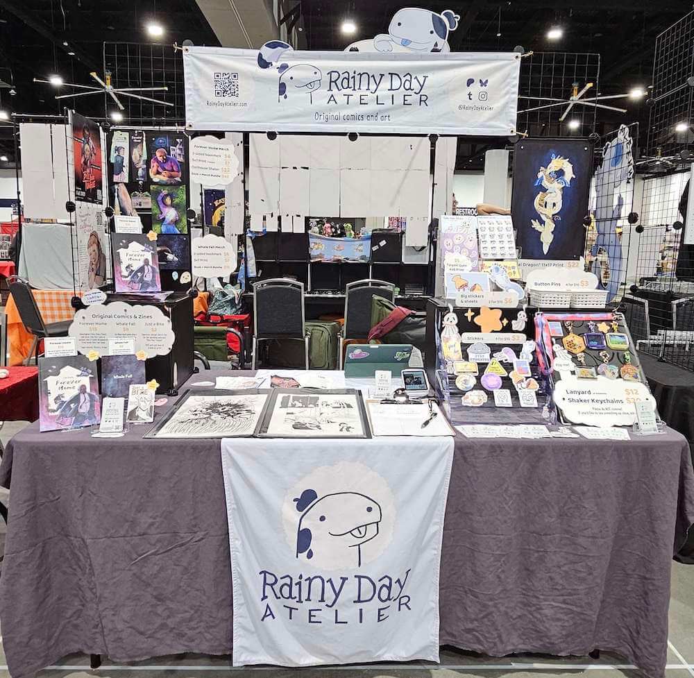 Photo of our table setup at Matthews Comic Con 2025
