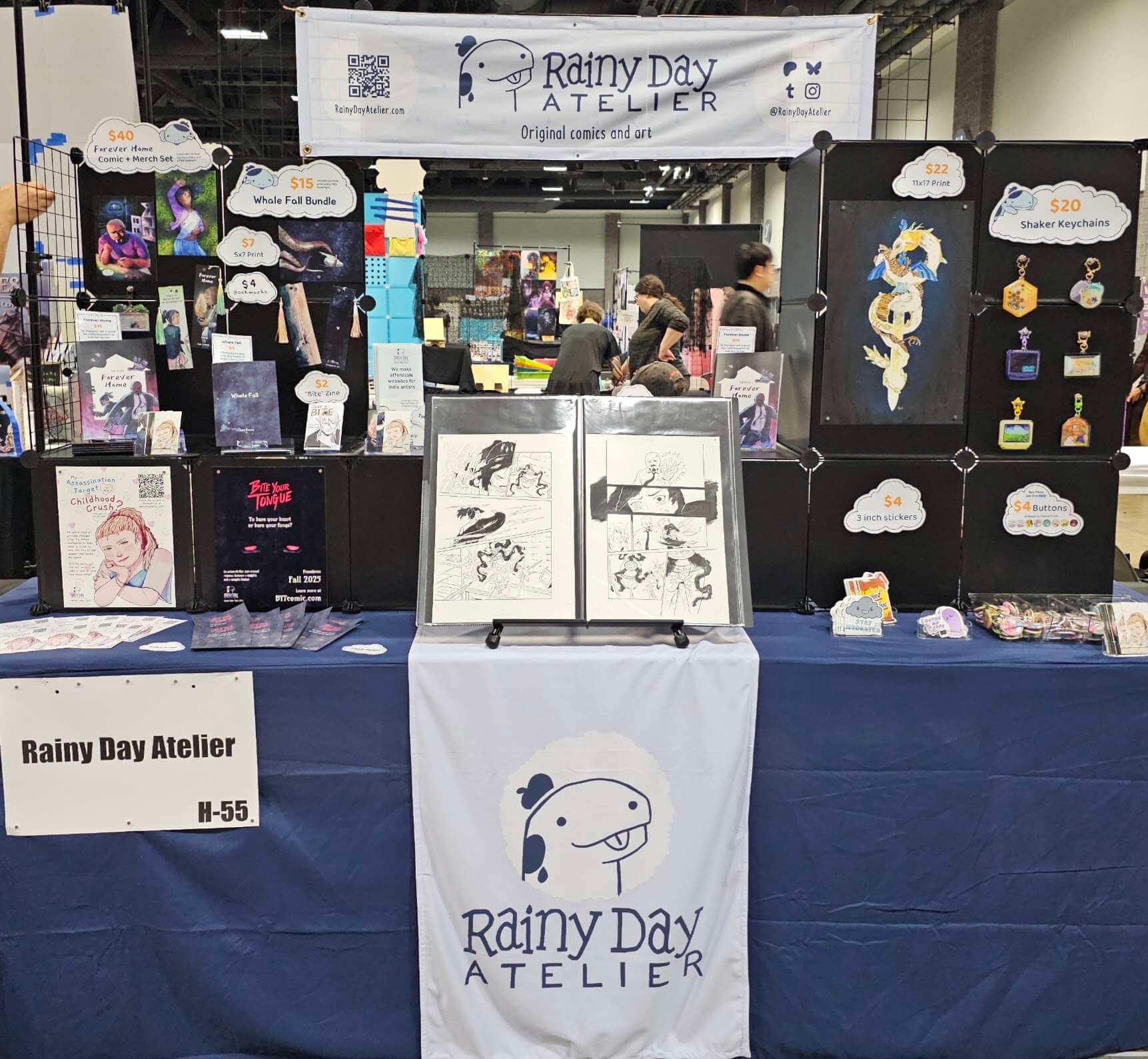 Photo of our table setup at Coastal Comic Con 2025